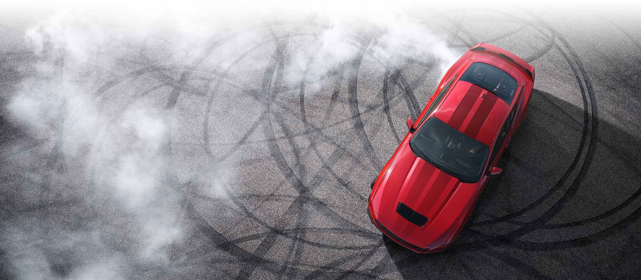 Overhead view of a 2024 Ford Mustang® model with tire tracks on pavement | Five Star Ford Lincoln in Aberdeen WA