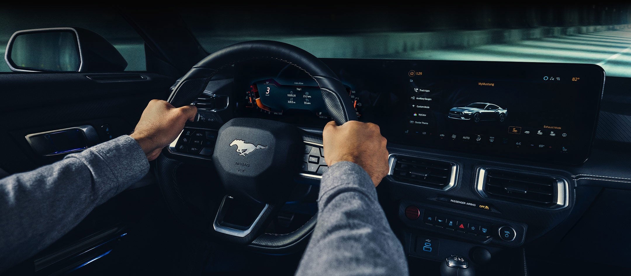 A 2024 Ford Mustang® model interior with a person driving | Five Star Ford Lincoln in Aberdeen WA