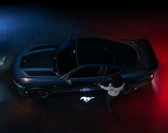 2024 Ford Mustang® Dark Horse™ model with a driver approaching the vehicle | Five Star Ford in Aberdeen WA